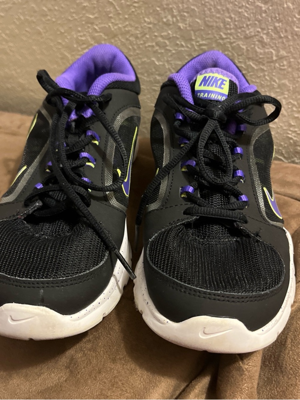 Nike Black Sneakers with Purple Accents and White Soles